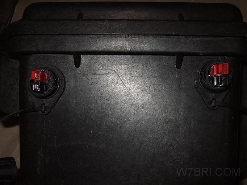 DC jacks - outside #1.JPG - I replaced the DC jack on the left and the antenna jack that used to be on the right with my   improved DC jacks   . Having two DC jacks lets me charge the battery pack while also powering a load, or power two loads.  The positive and negative wires from each jack are wired to different batteries in order to equalize the charge / draw.  They're individually-fused at 40 amps; both can provide approx.  80 amps .